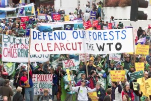 Original caption: Thousands of anti-World Trade Organziation protesters' march down Sixth Avenue in downtown Seattle, Washington, 29 November, 1999. Many more activist are expected to come to Seattle to disrupt the ministerial meetings of the World Trade Organization (WTO) which are scheduled from 30 November to 03 December. AFP PHOTO/John G. MABANGLO